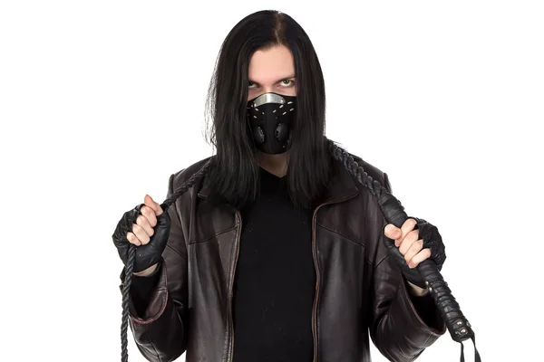 Photo of the young man with whip in mask — Stock Photo, Image