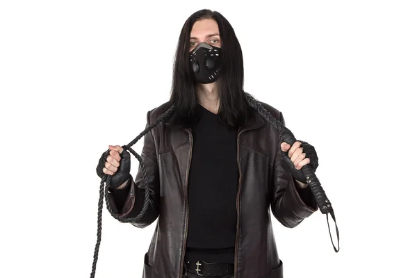 Photo of the young man with whip in black mask — Stock Photo, Image