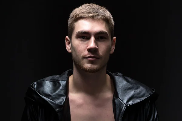 Portrait of the young man in hooding cloak — Stock Photo, Image