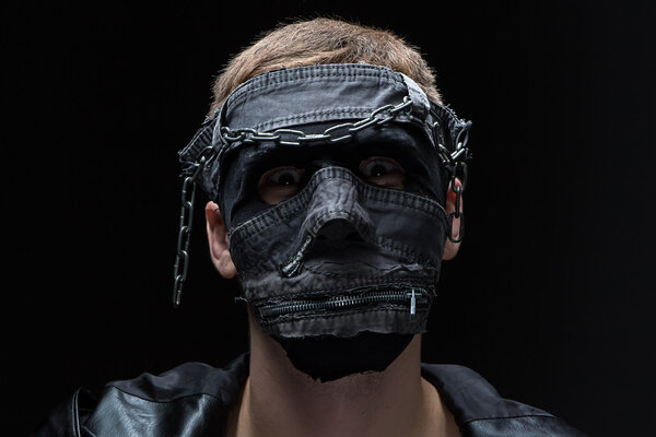 Image of madman in handmade mask