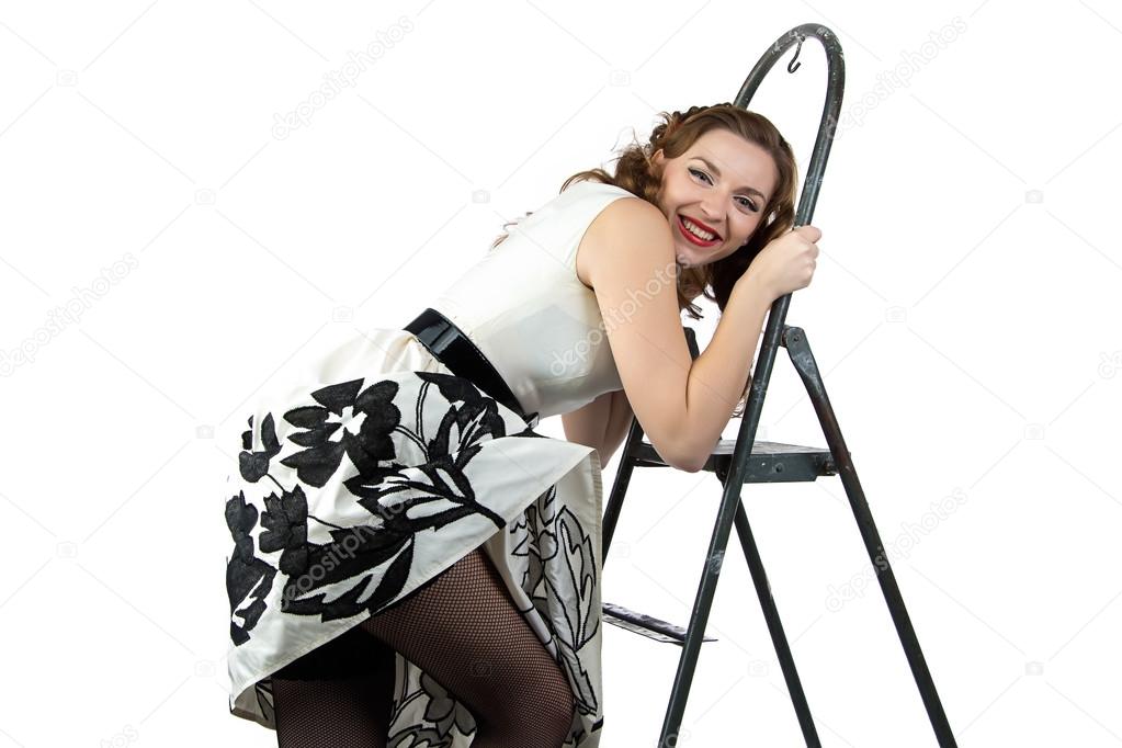 Image smiling pin up woman down the stairs