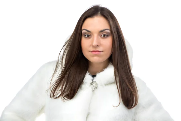 Image of serious woman in white fur coat — Stock Photo, Image