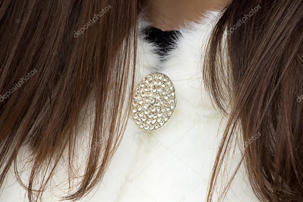 Photo of brooch on woman's fur coat