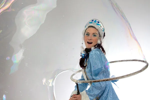 Photo of snow girl with soap bubbles — Stock Photo, Image