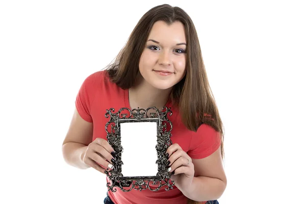 Portrait of smiling teenage girl with photo frame — Stock Photo, Image