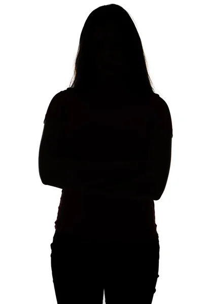 Silhouet van tiener met gekruiste armen — Stockfoto