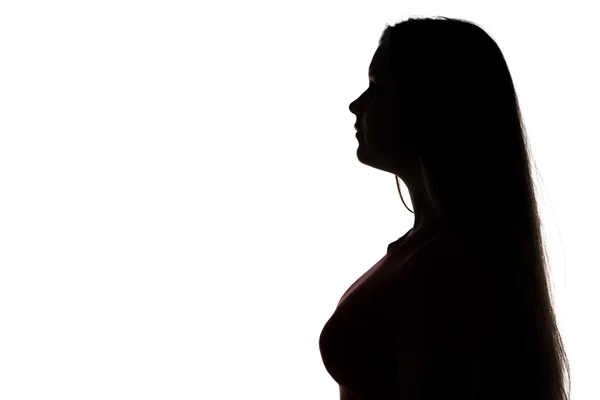 Silhouette di ragazza adolescente guardando altrove — Foto Stock