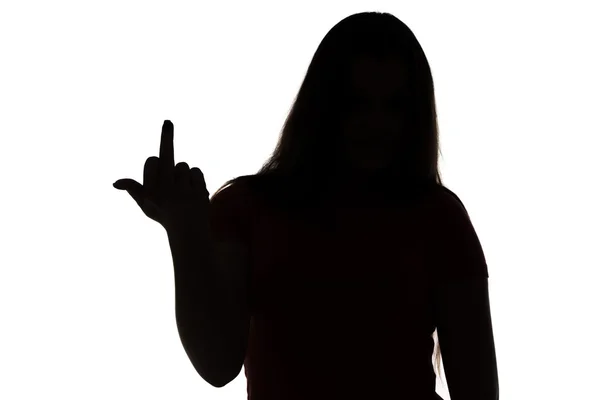 Silhouette of aggressive teenage girl — Stock Photo, Image