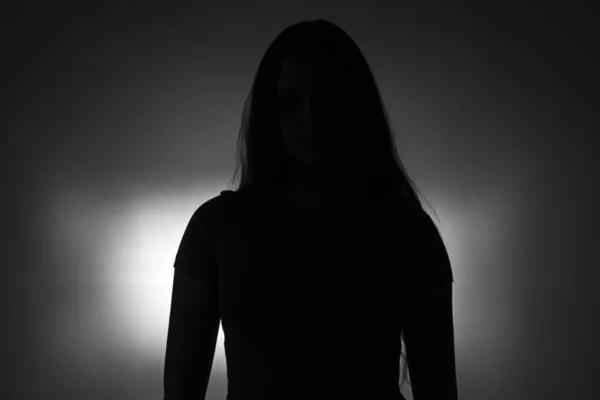 Silhouette of young  girl with long hair — Stock Photo, Image