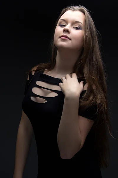 Photo of girl in black dress with hand — Stock Photo, Image