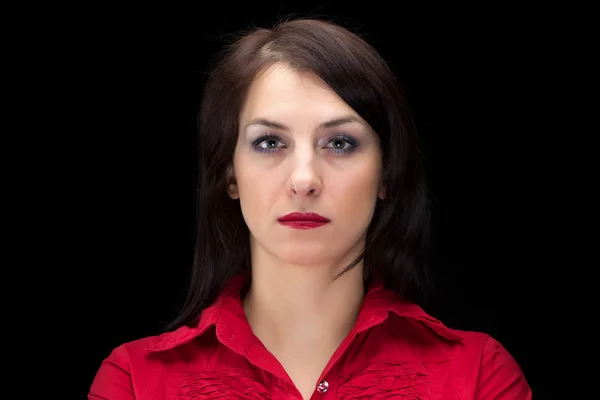 Portrait of serious woman in red shirt — Stock Photo, Image