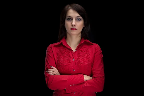 Portrait of woman in red shirt with arms crossed — Stock Photo, Image