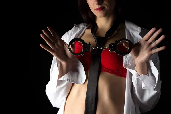 Image woman in men's shirt with pair of handcuffs — Stock Photo, Image