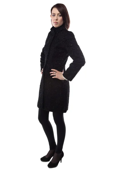 Изображение женщины в поддельном каракульском пальто — стоковое фото