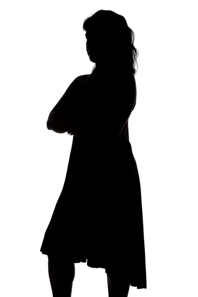 Silhouette of woman with arms crossed — Stock Photo, Image