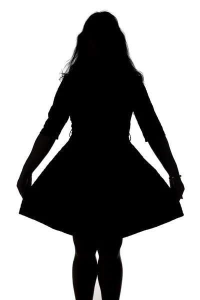 Silhueta de mulher olhando como uma menina — Fotografia de Stock