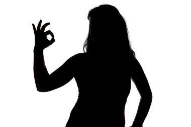 Fotoğraf okey gösterilen womans silueti