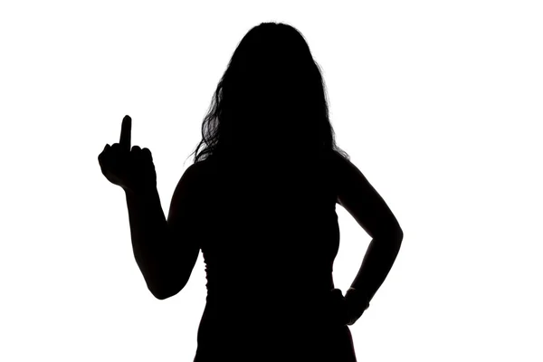 Photo of womans silhouette showing middle finger — Stock Photo, Image