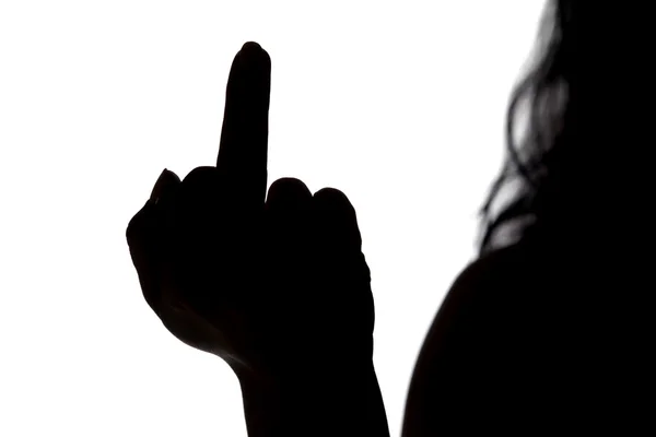 Silhouette of woman showing middle finger — Stock Photo, Image