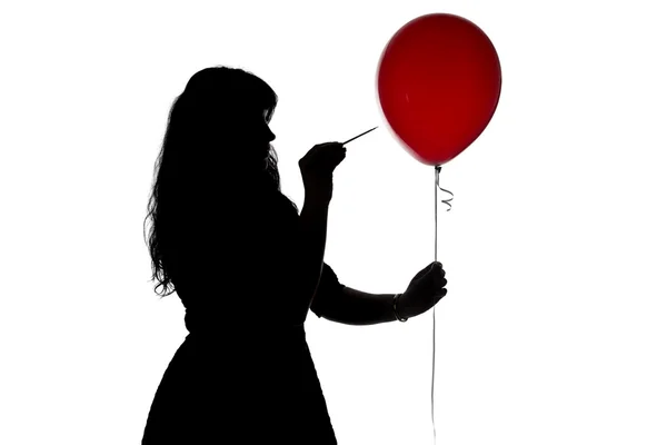 Silhouette femme percée d'une aiguille ballon — Photo