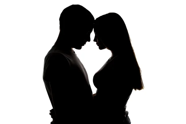 Silhouette di amorevole ragazza e ragazzo — Foto Stock