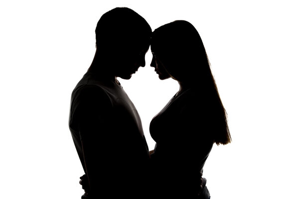 Silhouette of loving girl and boy