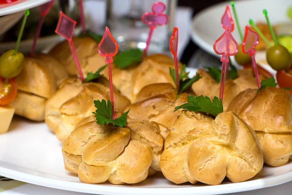 Photo of dish with ruddy profiteroles — Stock Photo, Image