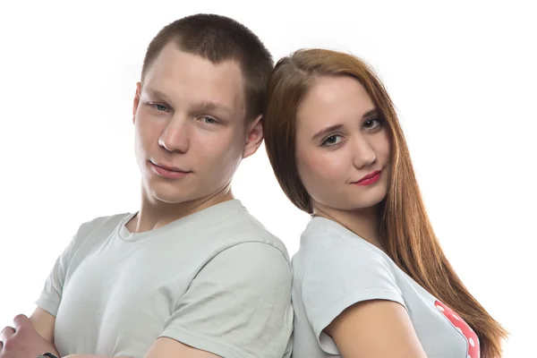 Portrait of two smiling teenagers back-to-back Royalty Free Stock Photos