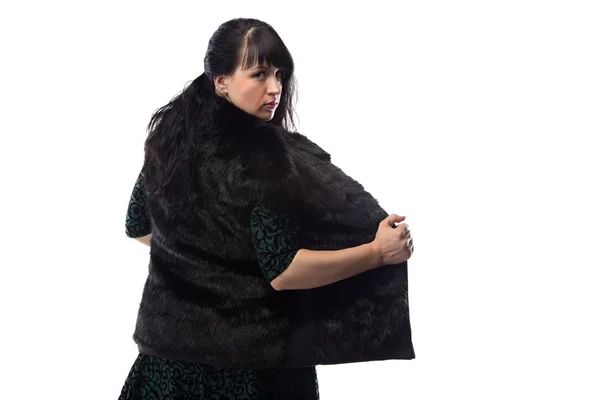 Portrait of woman showing fur jacket, from back — Stock Photo, Image