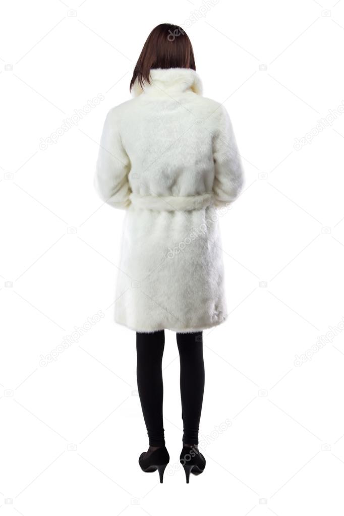Image of woman in white fur coat, from back