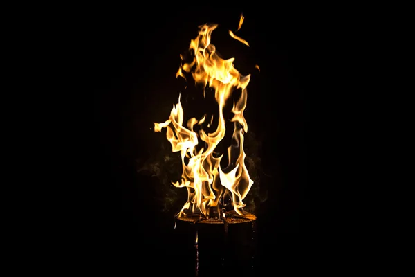 Photo of bright yellow flame by night — Stock Photo, Image