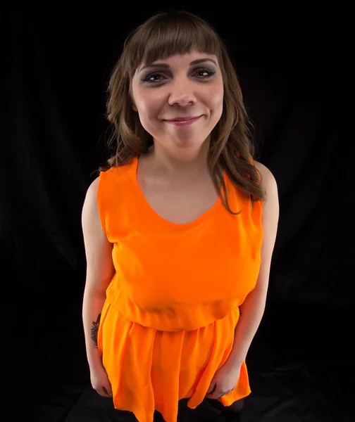 Foto de mujer feliz en vestido naranja — Foto de Stock