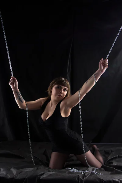 Photo of plump woman holding chains — Stock Photo, Image