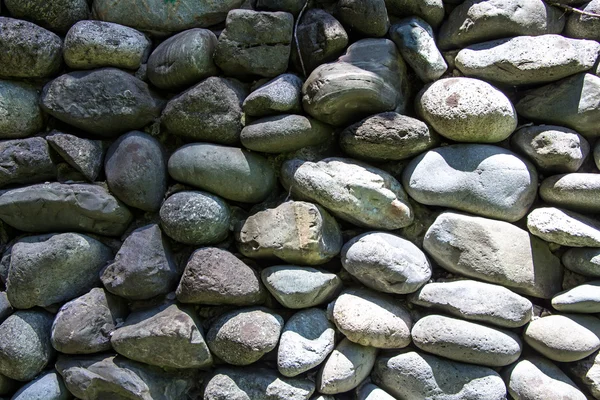 Photo of gray stones in the sun and shadow — Stock Photo, Image
