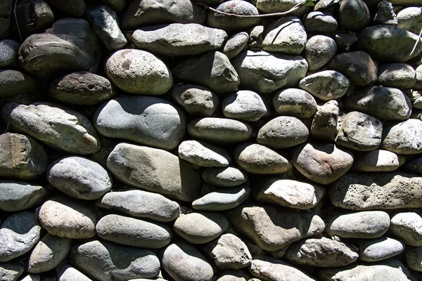 Photo gray stones in the sun — Stock Photo, Image