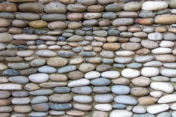 Photo of the wall exactly paved with stones — Stock Photo, Image