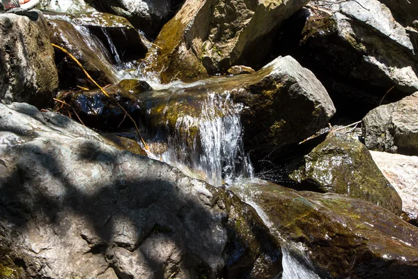 Photo of flowing water and big stones — Stock Photo, Image