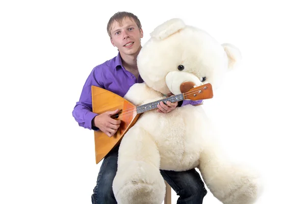 Image of a man playing the balalaika — Stock Photo, Image