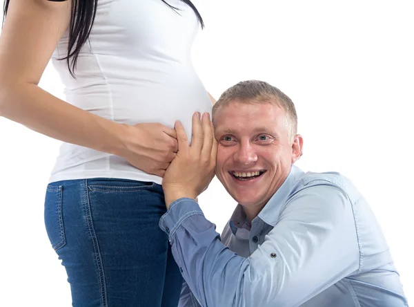 Foto naslouchající šťastný člověk a Zenske břicho — Stock fotografie