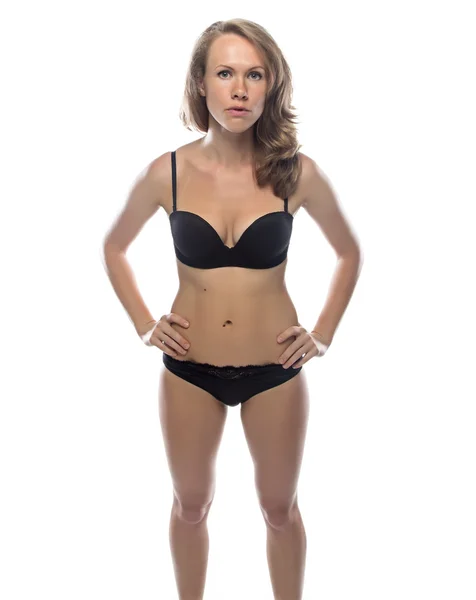 Donna bionda in lingerie nera, figura snella — Foto Stock