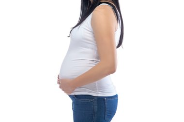 Profil, yüzü olmayan genç hamile kadın