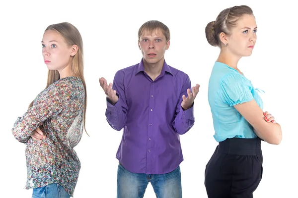 Confused blond man and two young women — Stock Photo, Image