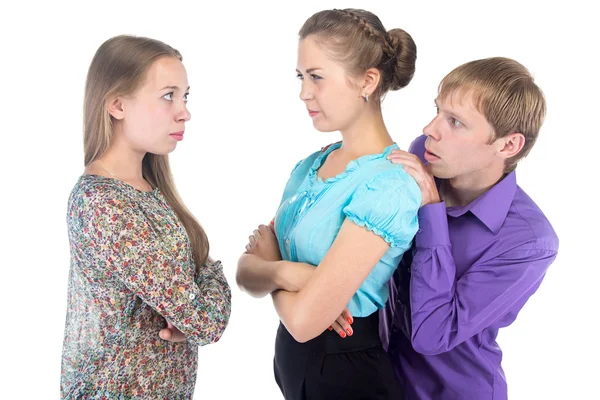 Cowardly blond man and two young women — Stock Photo, Image