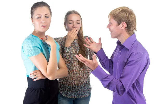 Speaking blond man and two women — Stock Photo, Image