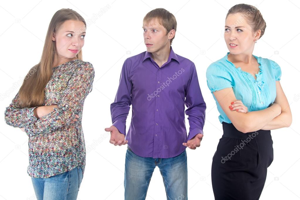 Puzzled blond man and two young women