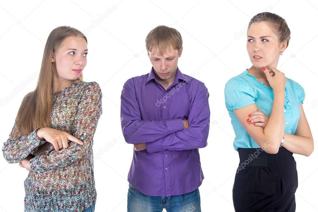 Puzzled young man and two women