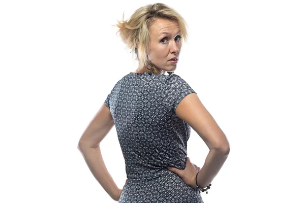 Isolated portrait of blond woman in dress looking back — Stock Photo, Image