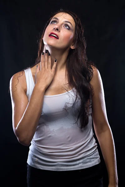 Wet woman in white t-shirt looking up — Stock Photo, Image