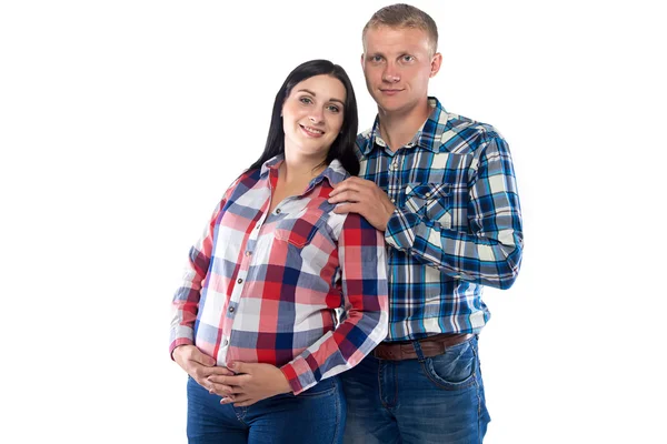 Беременная женщина и муж позади нее — стоковое фото
