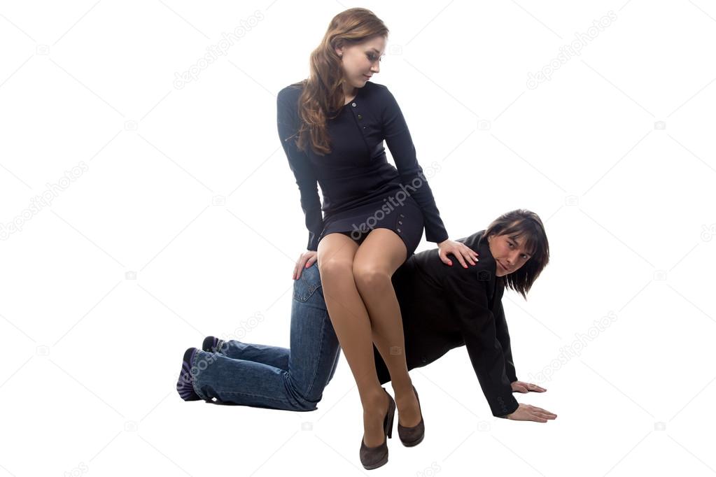Woman sitting on man in black